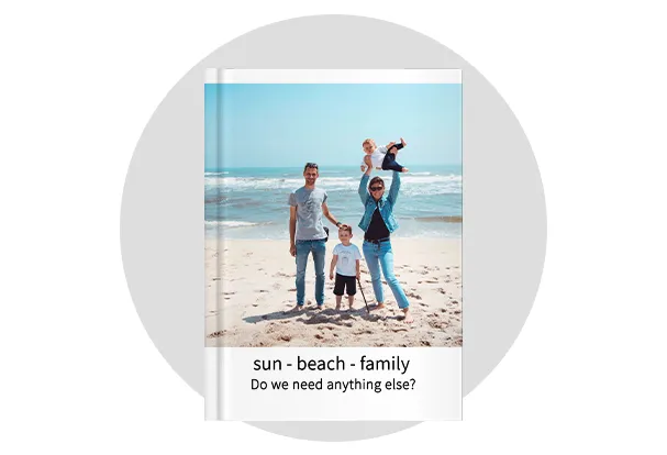 Photo book with its cover showing a beach snapshots of a young family and a cheerful text. Turn your best memories into a high-quality photo book!