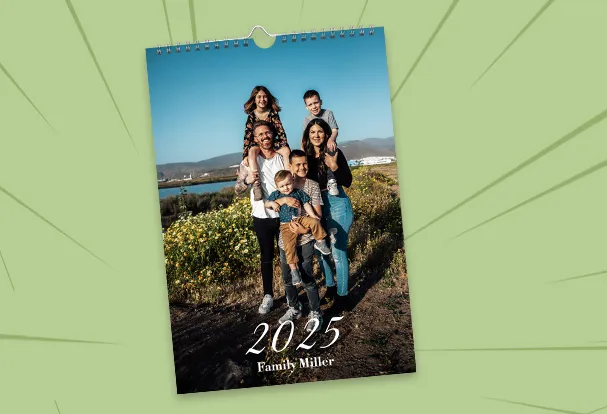 Personalised A4 photo calendar in portrait format – 2026 wall calendar with glossy pages and silver spiral binding.